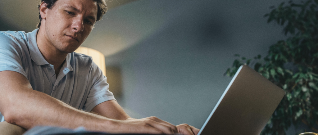 Veteran studying for an IT career while typing on a laptop